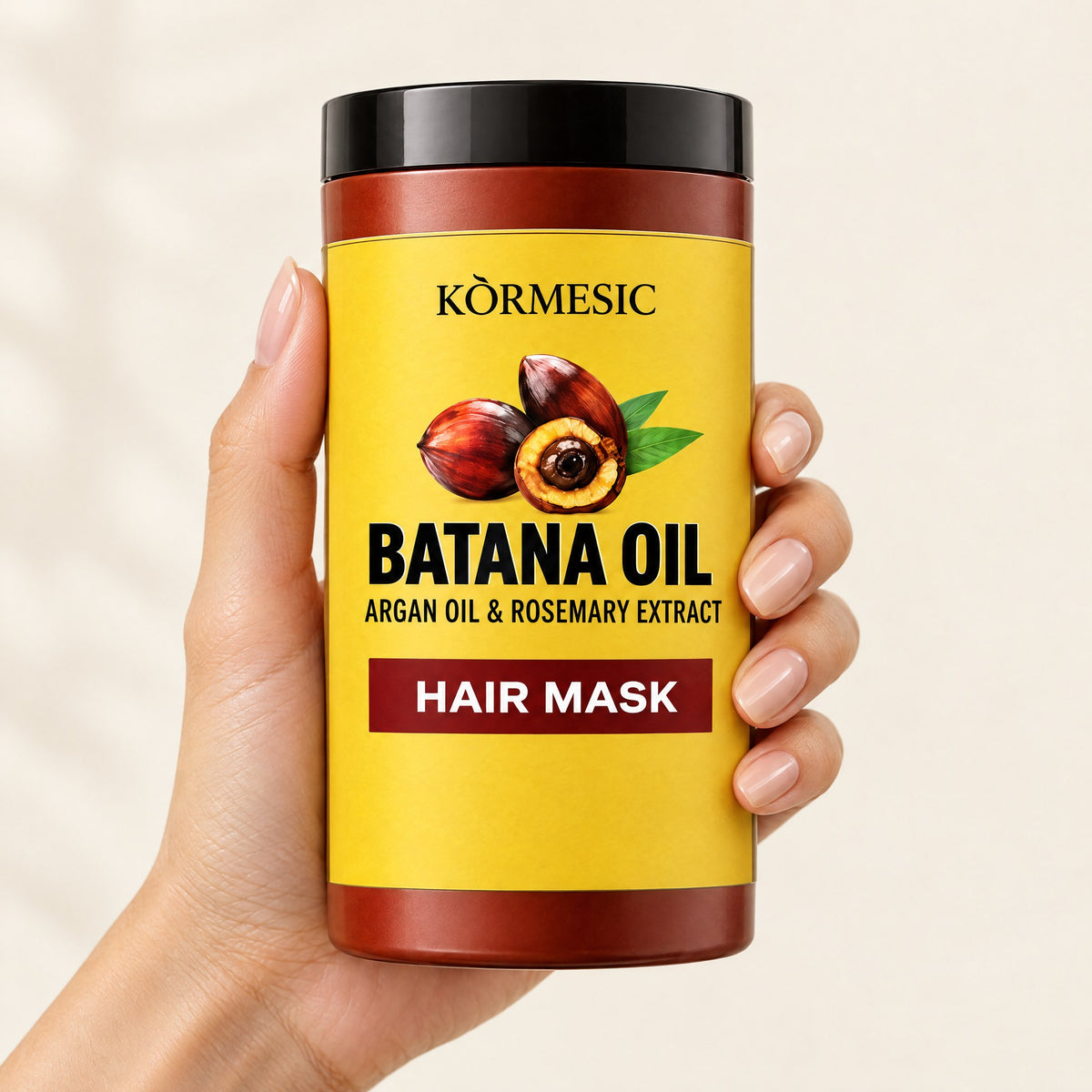 KÒRMESIC Batana Oil Hair Mask, Argan & Rosemary, shown in hand